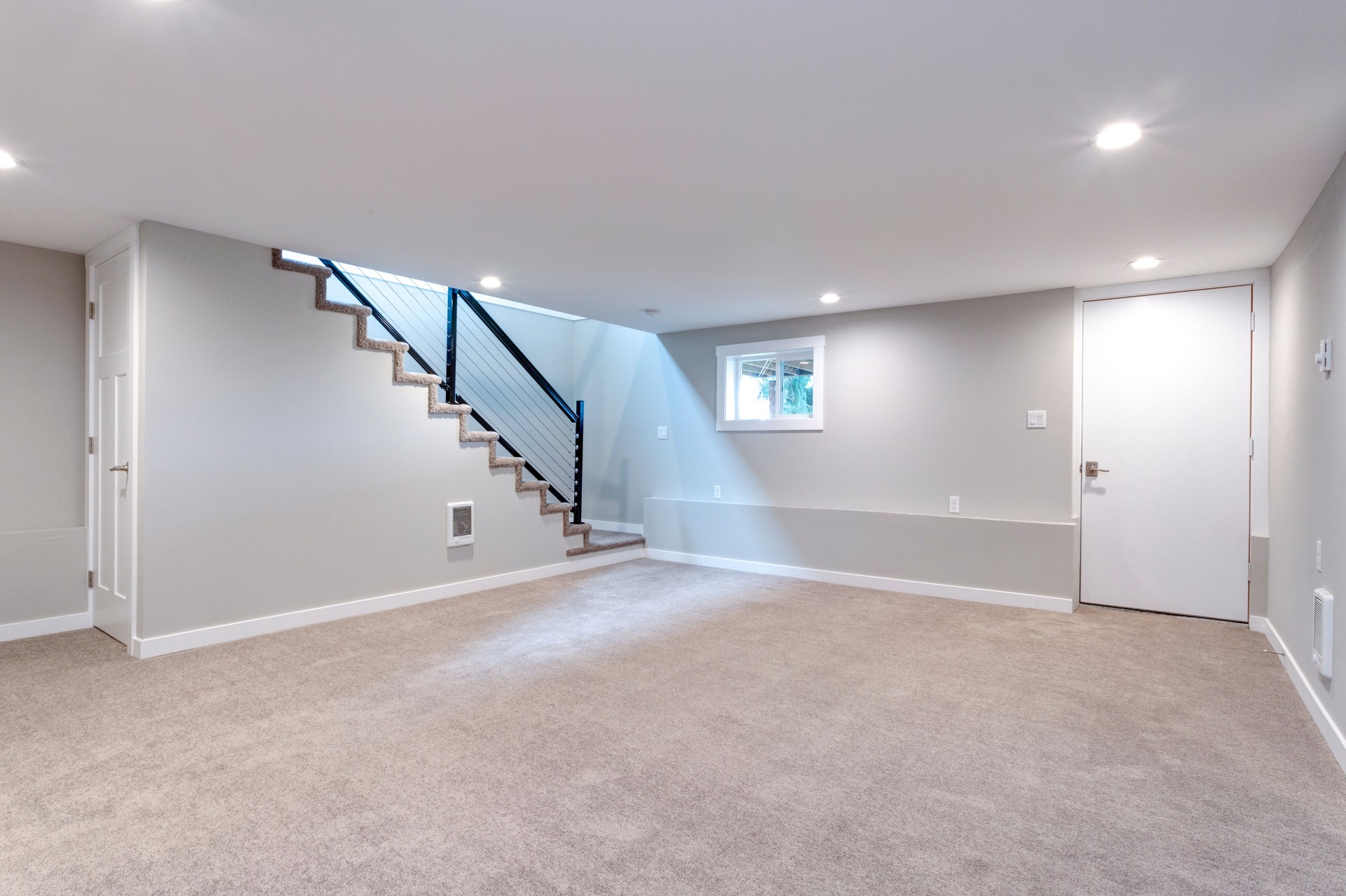 Recently cleaned light spacious basement area with staircase